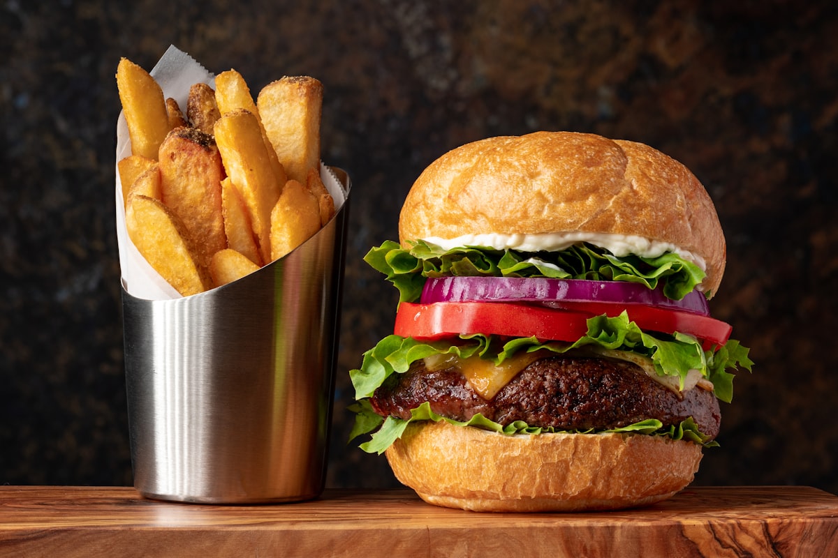 Cheeseburger and fries served in a basket